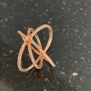 Rose gold tone metal with crystals